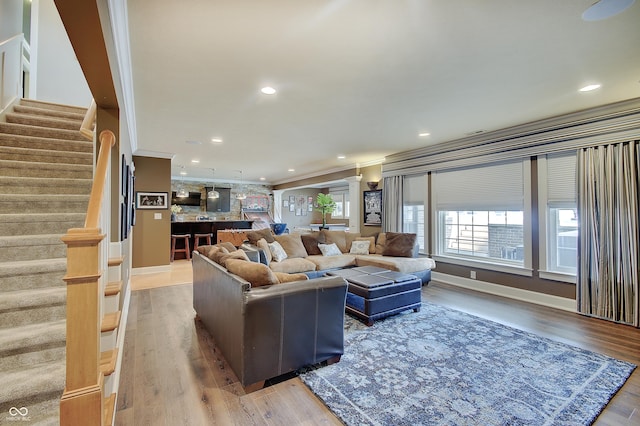 14445 Gainesway Cir, Fishers, IN 46040 - living area featuring stairway, crown molding, wood finished floors, and recessed lighting