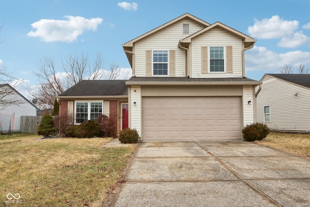 view of property with a garage and a front yard