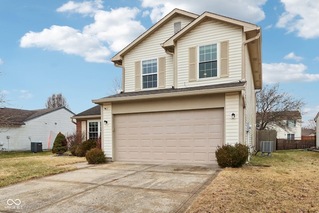 front of property with a garage, central AC, and a front lawn