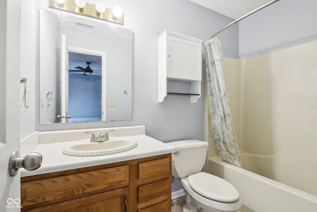 full bathroom with vanity, toilet, and shower / bath combo with shower curtain