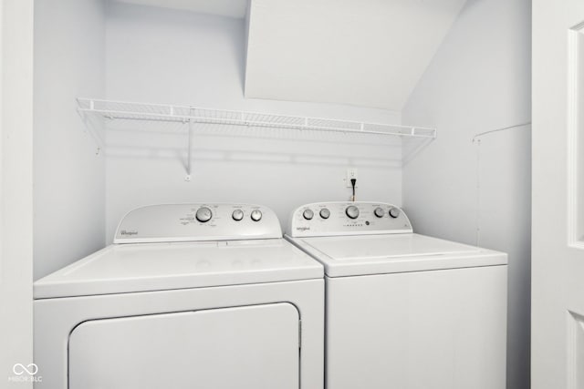 washroom with washing machine and clothes dryer