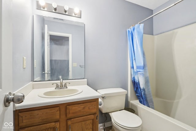 full bathroom with vanity, shower / bath combo with shower curtain, and toilet