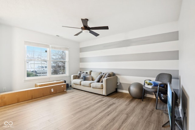 interior space with ceiling fan and light hardwood / wood-style floors