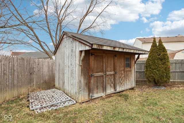 view of outdoor structure featuring a lawn