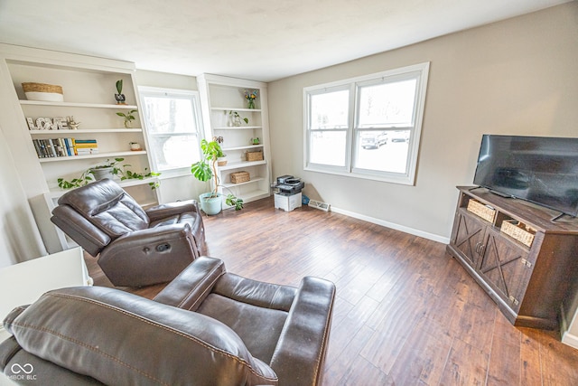 living area with dark hardwood / wood-style floors