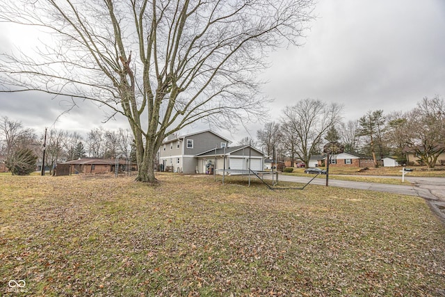 view of yard featuring a garage