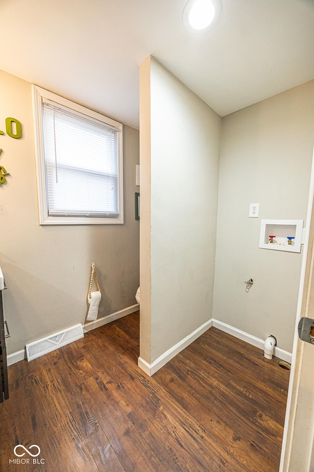 washroom featuring washer hookup and dark wood-type flooring