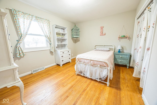 bedroom featuring hardwood / wood-style flooring