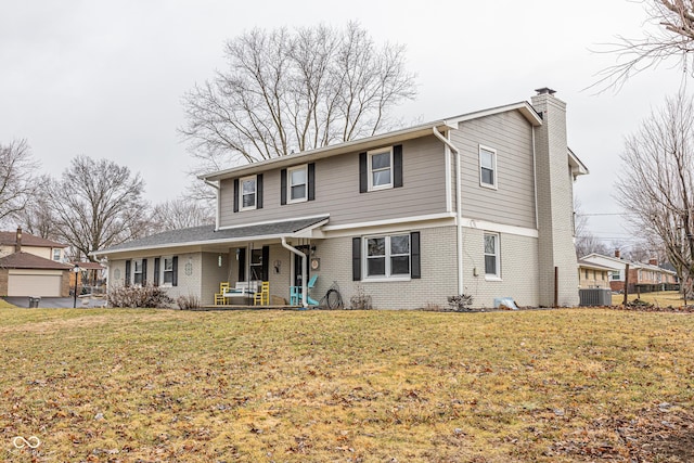 view of front property with central AC and a front yard