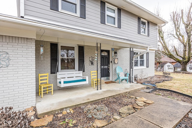 doorway to property with a porch