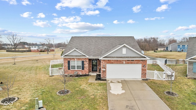 view of front of house featuring a garage and a front yard