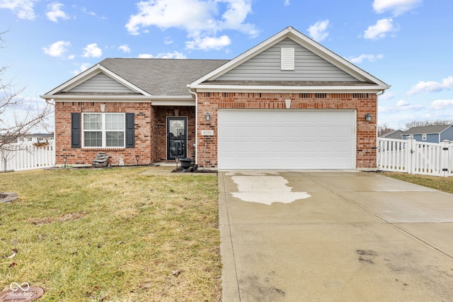 view of front of house with a garage and a front yard