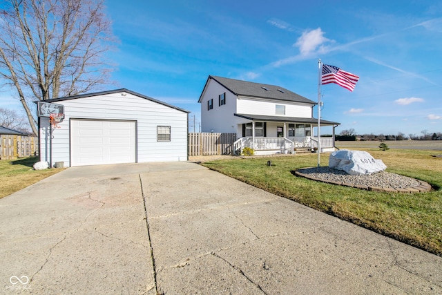 view of front of home with a garage, covered porch, and a front lawn