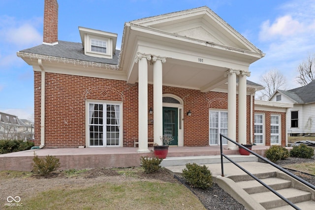 greek revival house with covered porch