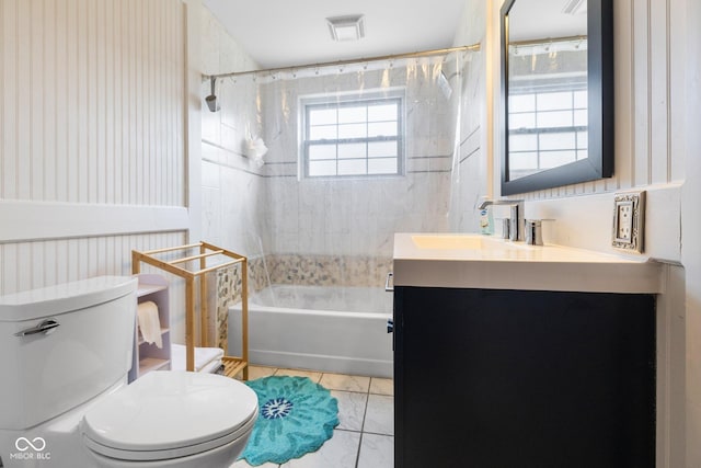 full bathroom featuring vanity, shower / bathtub combination with curtain, tile patterned floors, and toilet