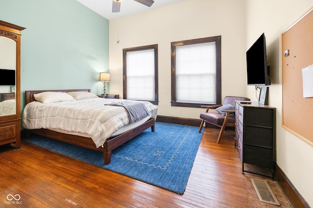 bedroom featuring dark hardwood / wood-style flooring and ceiling fan