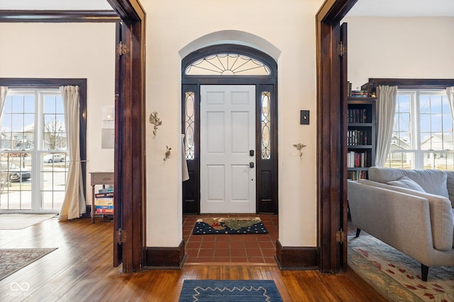 entrance foyer with a healthy amount of sunlight and wood-type flooring