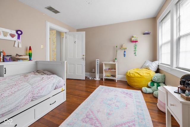 bedroom featuring dark hardwood / wood-style floors