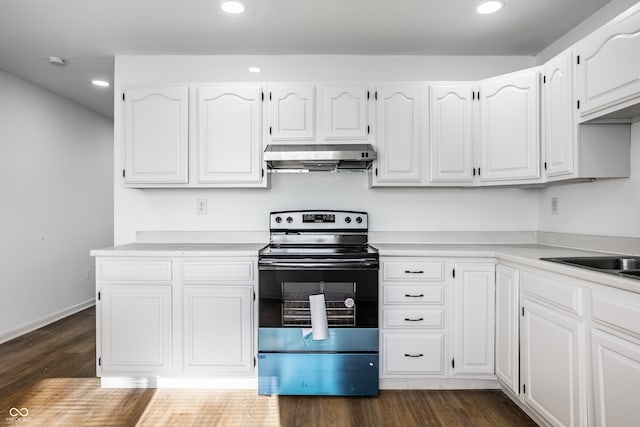 kitchen featuring white cabinetry, extractor fan, range with electric cooktop, and dark hardwood / wood-style floors