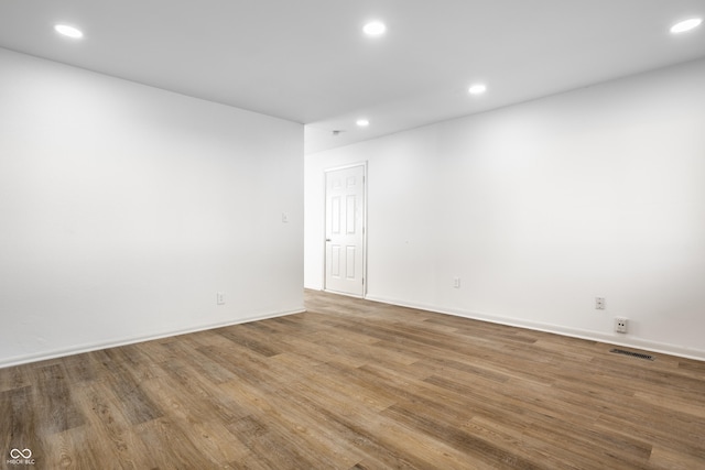 spare room featuring hardwood / wood-style floors