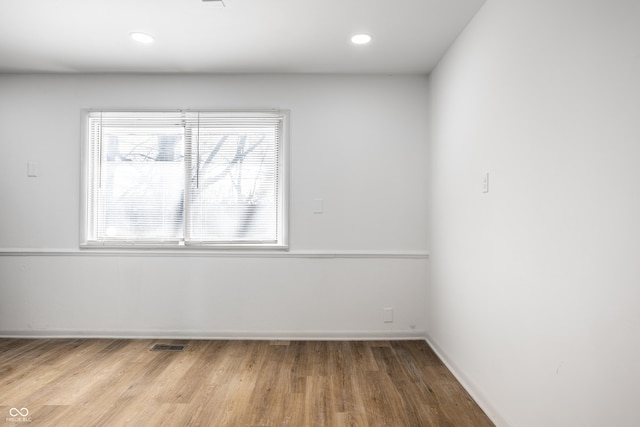 unfurnished room featuring light hardwood / wood-style flooring