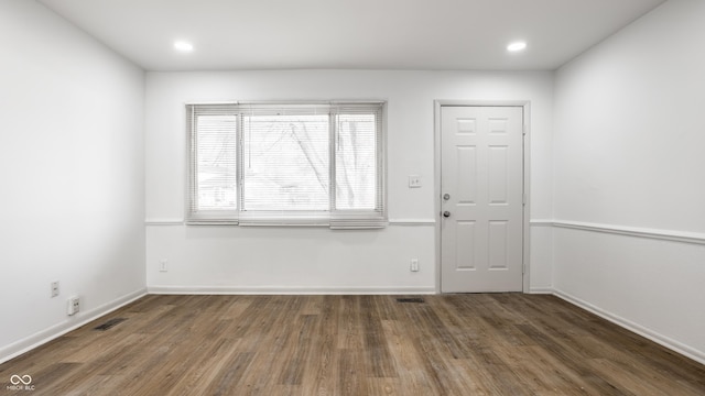 entryway with dark hardwood / wood-style floors