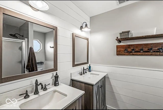 bathroom with vanity and an enclosed shower