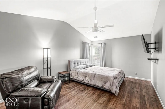 bedroom featuring vaulted ceiling, wood-type flooring, and ceiling fan