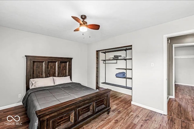 bedroom with hardwood / wood-style flooring and ceiling fan