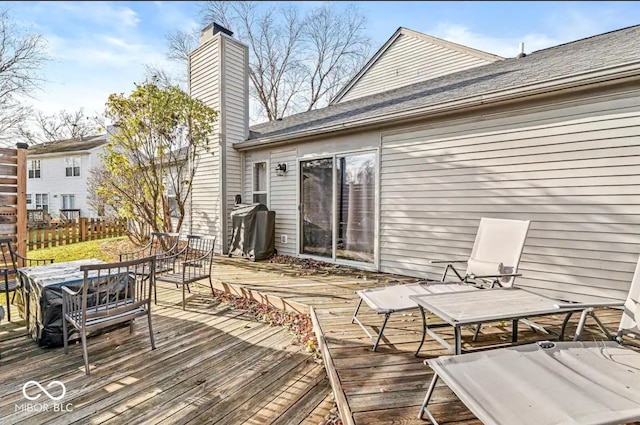 wooden terrace featuring area for grilling