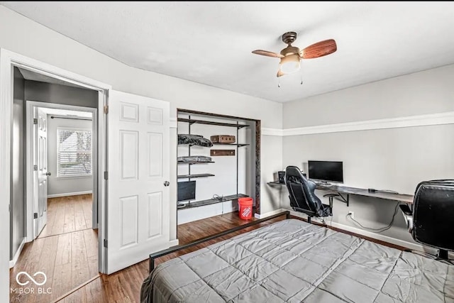 bedroom featuring ceiling fan and hardwood / wood-style floors