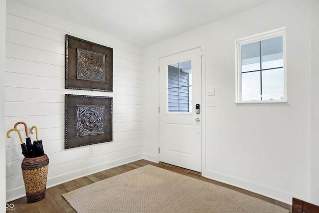 foyer with dark hardwood / wood-style floors