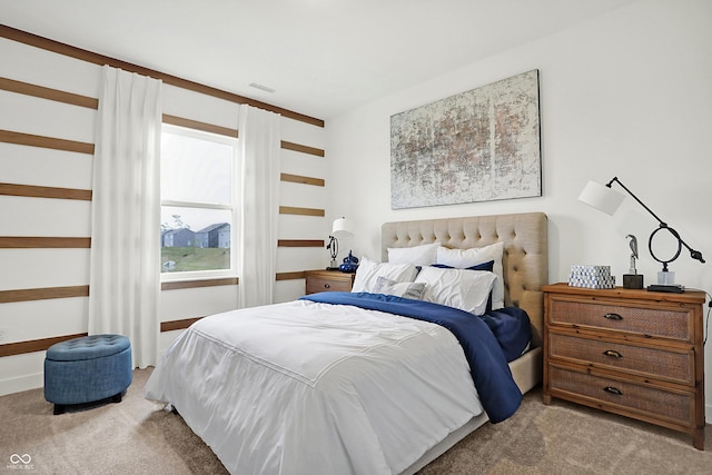 bedroom featuring light carpet