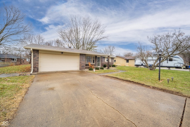 ranch-style home with a garage and a front yard