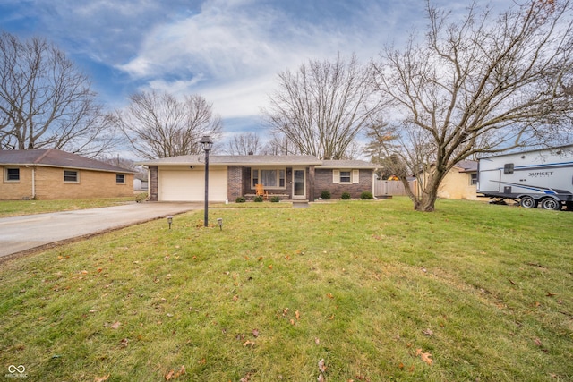 single story home featuring a garage and a front yard