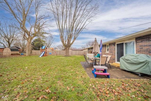 view of yard with a patio and a playground