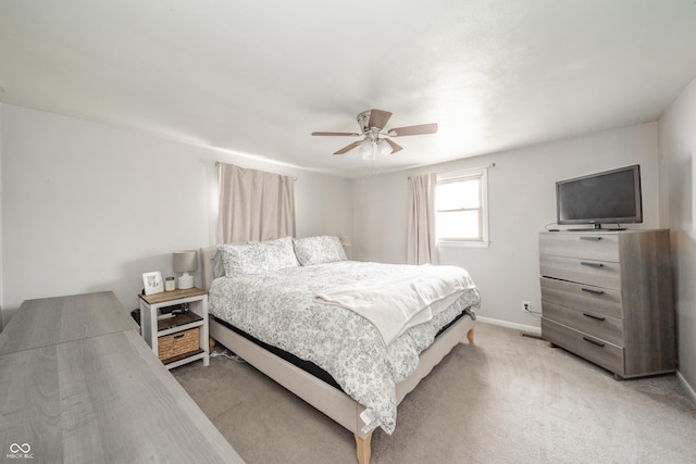 bedroom featuring ceiling fan and light colored carpet