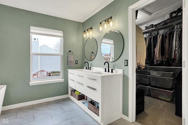 bathroom featuring vanity and a textured ceiling