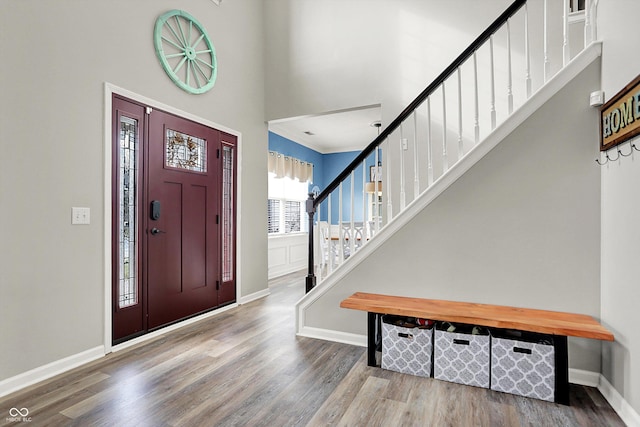 foyer featuring a high ceiling and wood-type flooring