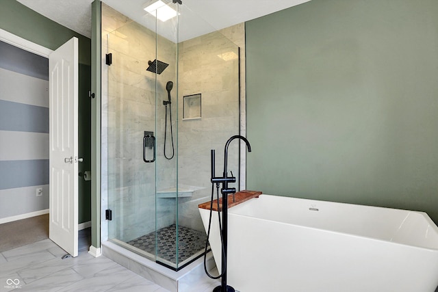 bathroom featuring separate shower and tub