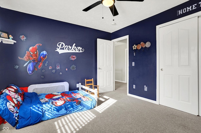 carpeted bedroom featuring ceiling fan