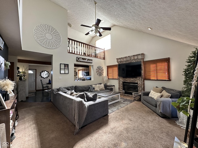 carpeted living room with ceiling fan, high vaulted ceiling, and a textured ceiling