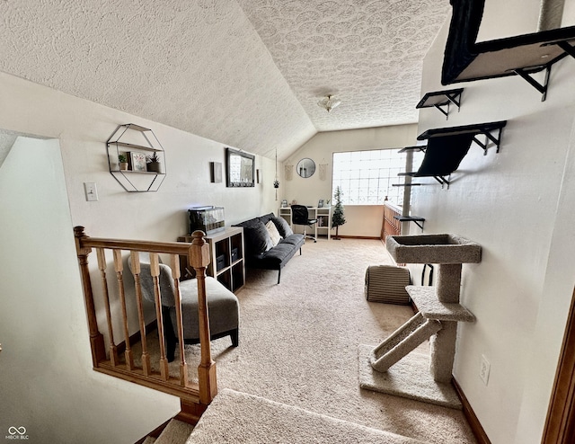 living room with lofted ceiling, carpet, and a textured ceiling