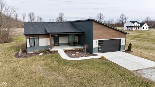 view of front of house with a garage and a front yard