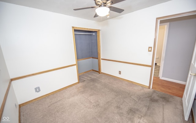 unfurnished bedroom featuring light carpet and ceiling fan