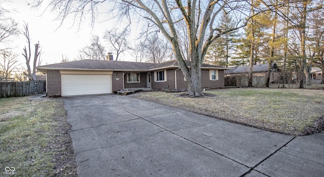 single story home with a garage and a front yard