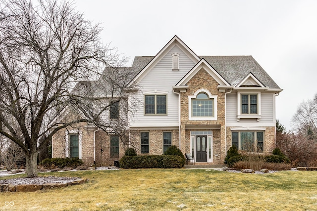 view of front of home with a front lawn