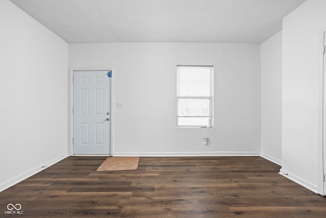 spare room featuring dark hardwood / wood-style flooring