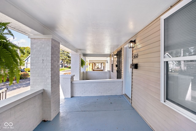 view of patio featuring a porch