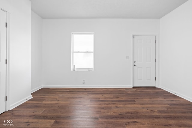 empty room featuring dark hardwood / wood-style floors